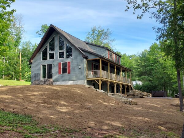 new custom modular cape chalet home project with walk out basement and porch completed by Brookewood Builders, Manchester, ME 04351